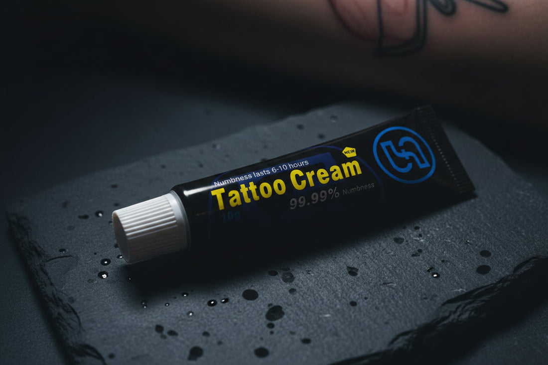 Perfso tattoo numbing cream tube on dark stone surface with tattooed arm in background