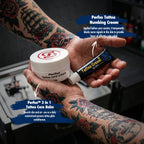 Tattooed hands holding Perfso Tattoo Numbing Cream and 3-in-1 Care Balm in a tattoo studio